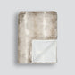 Textured rabbit blanket with a gradient pattern on a light gray background