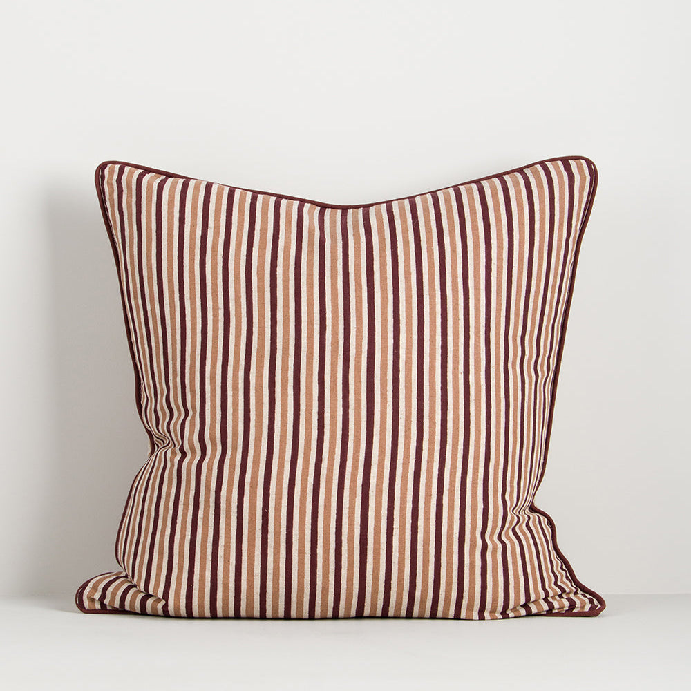 striped cushion in dark red and brown with piped red edge