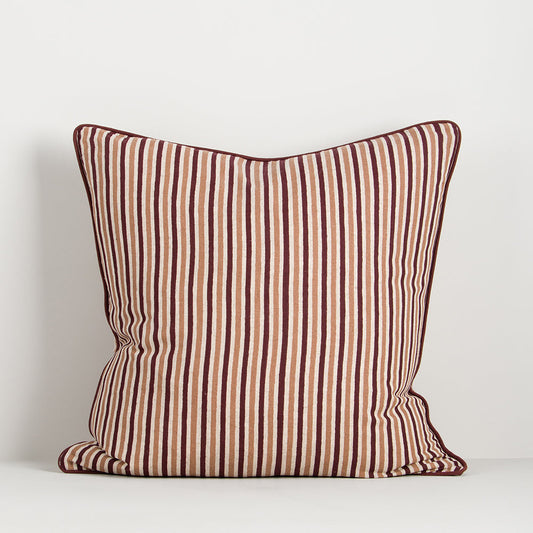 striped cushion in dark red and brown with piped red edge