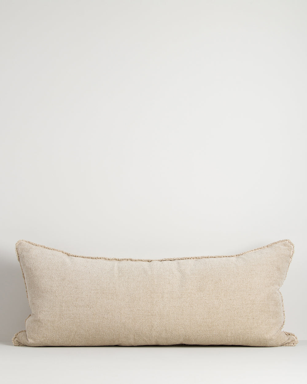 Beige pillow on a white background