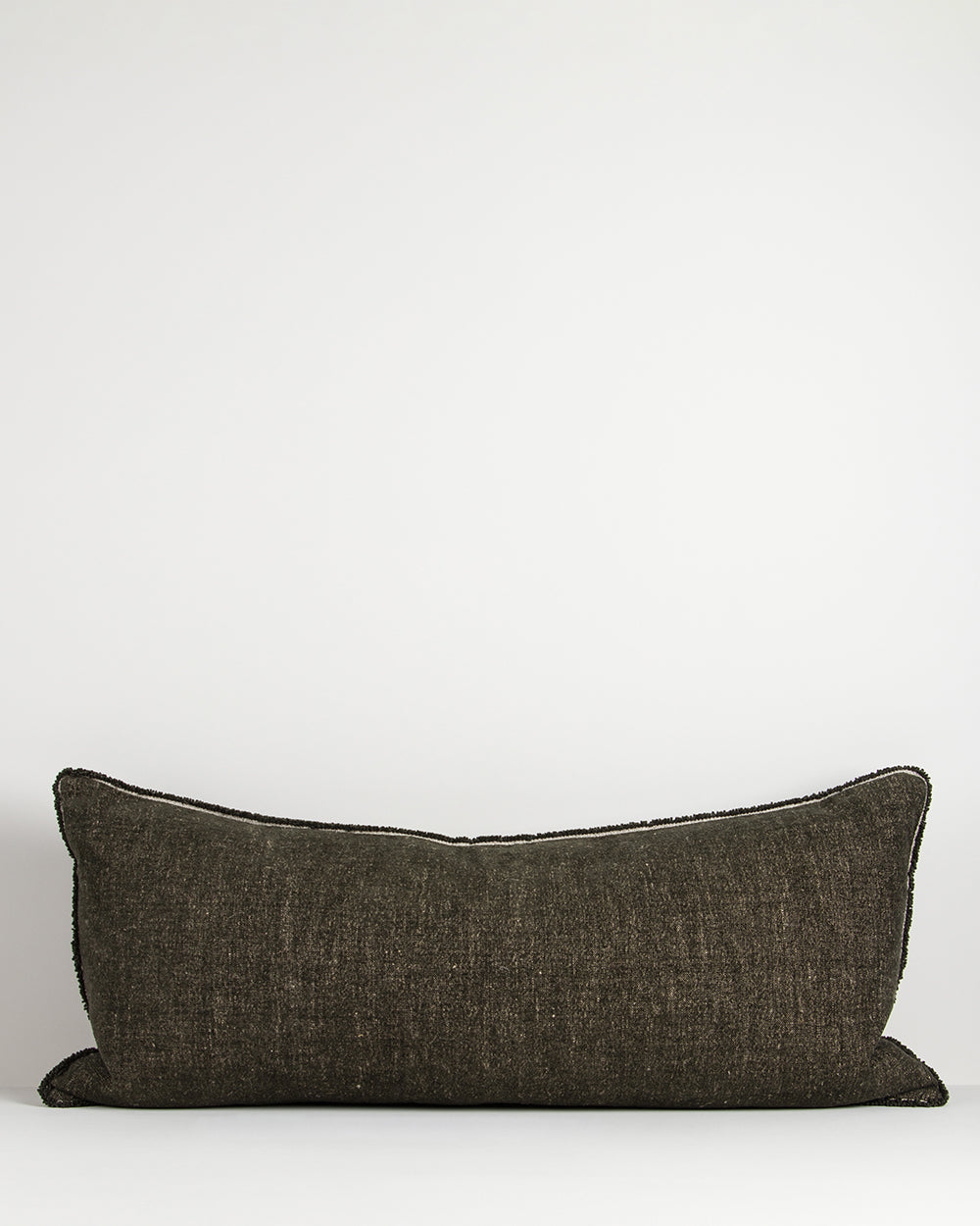 Dark gray pillow on a white background