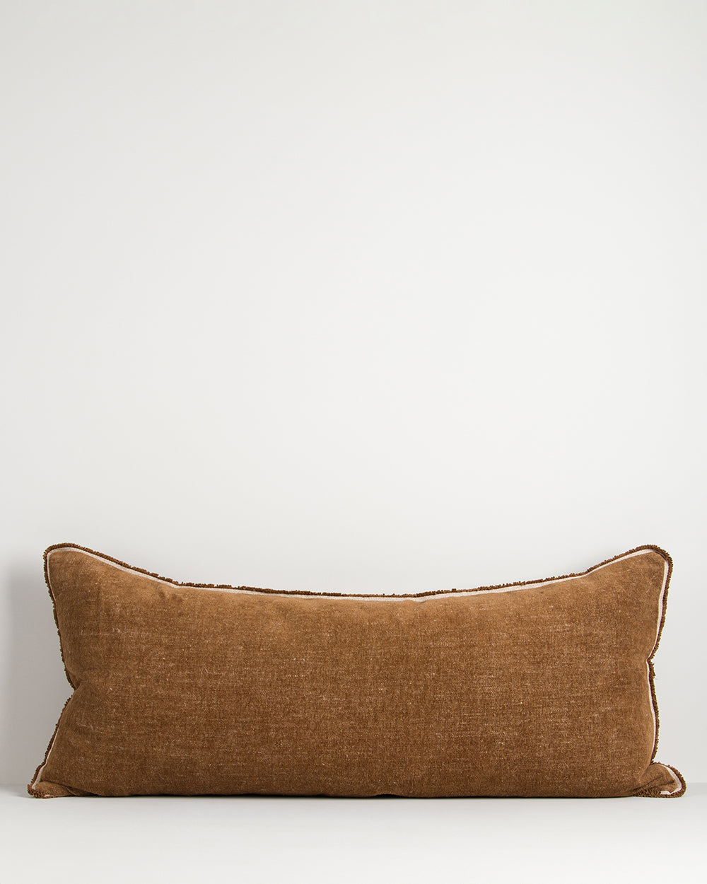 Brown pillow on a white background