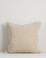 Beige pillow on a light gray background