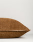 Brown textured pillow on a light gray background