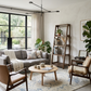 Modern living room with gray sofa, wooden coffee table, and bookshelf.