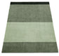 Rectangular green rug with a striped pattern on a white background