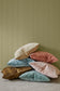 Ava cushion, velvet cushion from Weave Home, lifestyle shot with 6 coloured Ava cushions