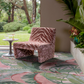 Bengal fabric in whiskey in a lifestyle shot with a pink and green carpet