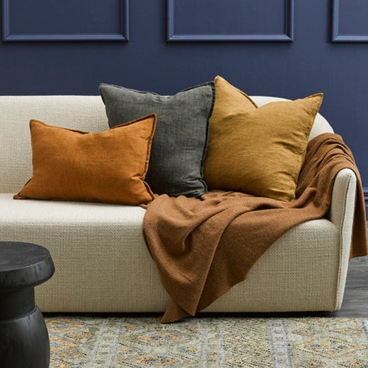 Cassia Linen cushion, plain linen, 3 cushions on sofa with throw