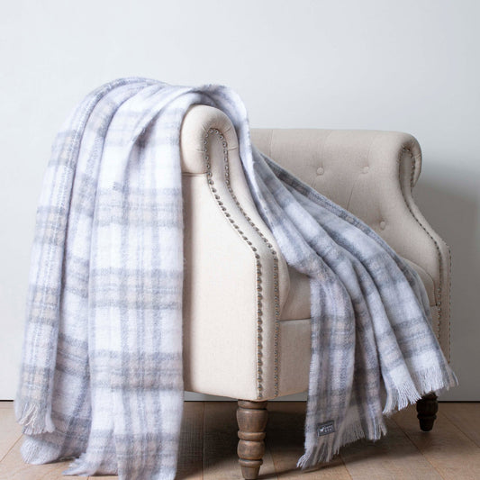 Soft Mohair luxury throws from Glamorous Goat.  Mohair throw in Tussock Tartan grey and white available at My Sanctuary