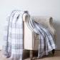 Soft Mohair luxury throws from Glamorous Goat.  Mohair throw in Tussock Tartan grey and white available at My Sanctuary