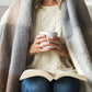 Soft Mohair luxury throws from Glamorous Goat.  Mohair throw in Pembroke brown and grey check available at My Sanctuary