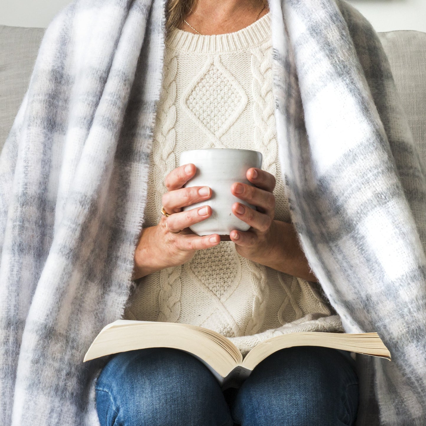 Soft Mohair luxury throws from Glamorous Goat.  Mohair throw in Tussock Tartan grey and white available at My Sanctuary