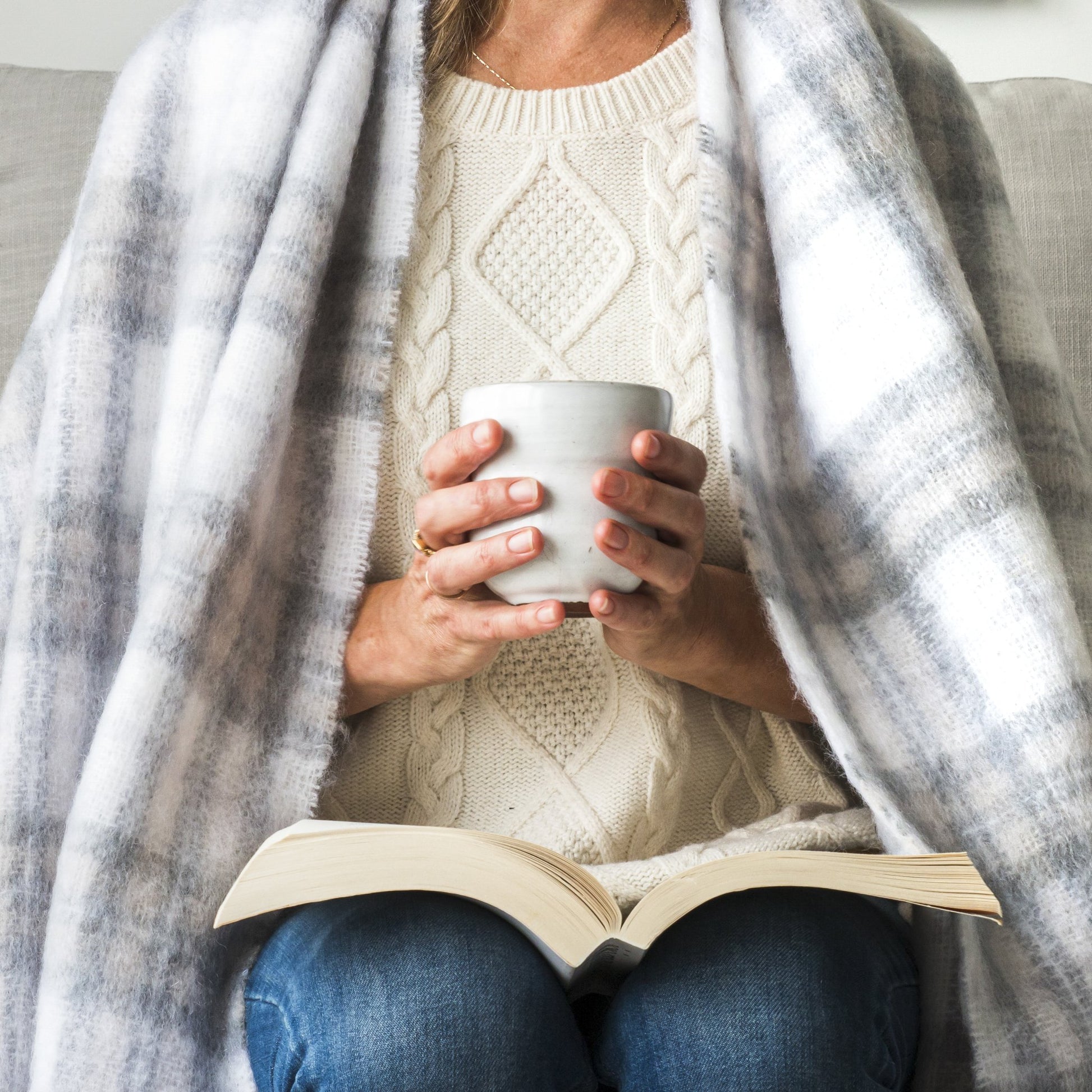 Soft Mohair luxury throws from Glamorous Goat.  Mohair throw in Tussock Tartan grey and white available at My Sanctuary
