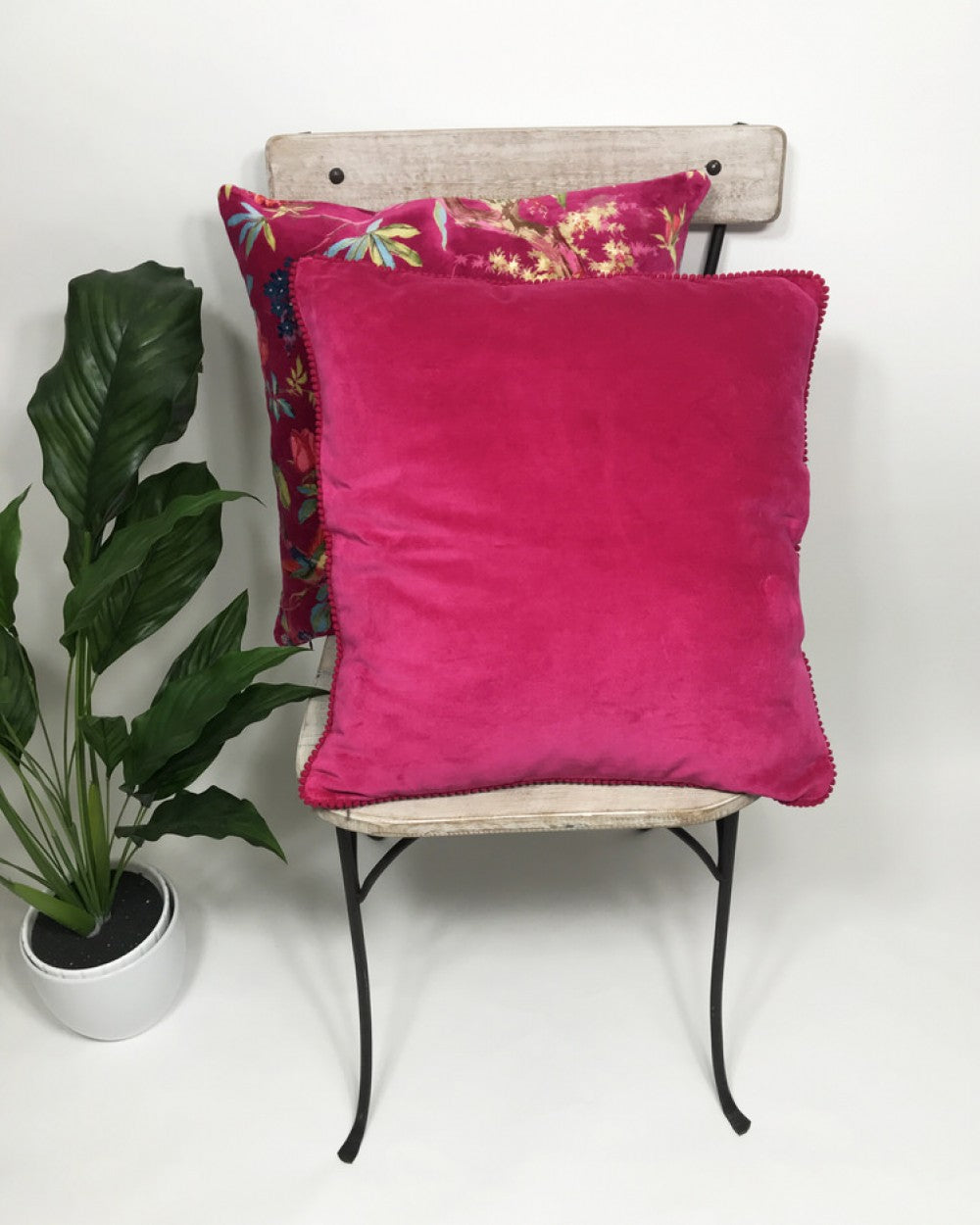 Paradise hot pink cushion with bird of paradise pattern