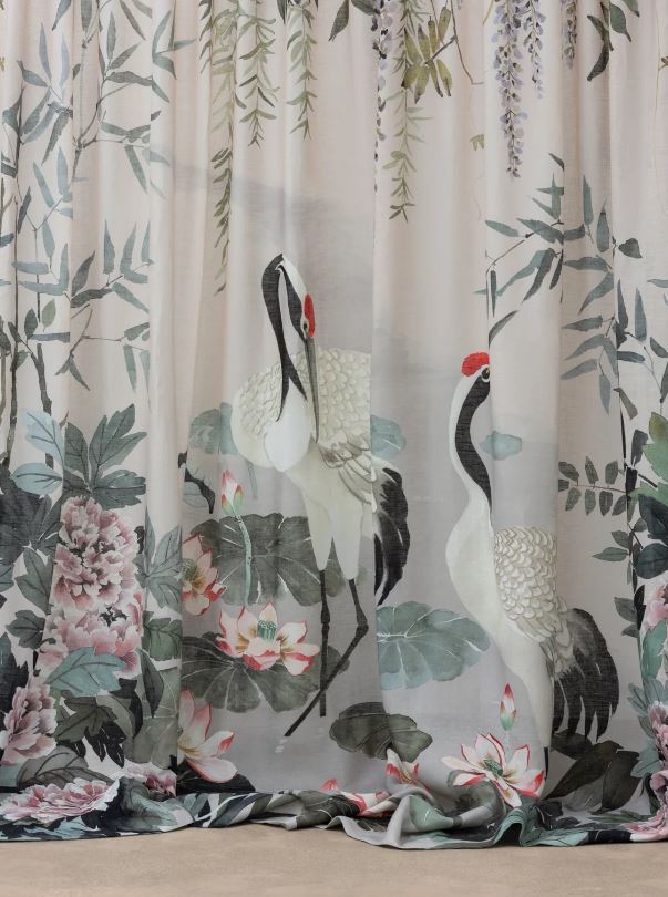 Mizu garden fabric panel from mokum featuring 2 cranes, pink peonies, wisteria and green bamboo and foliage in a serene water garden as curtains