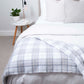 Soft Mohair luxury throws from Glamorous Goat.  Mohair throw in Tussock Tartan grey and white available at My Sanctuary