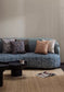 Nasir animal fabric on a blue sofa with cushions