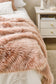 Luxury faux fur throw Peony Plume in pale pink from Heirloom.  These are the best fake fur throws, super soft for NZ interior design