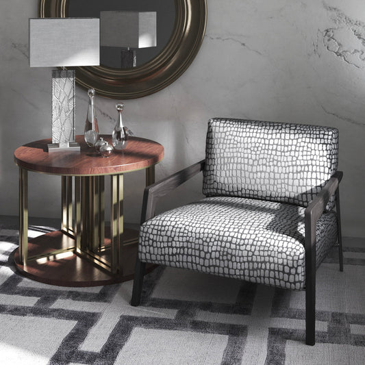 Cazador fabric part of the Sauvage collection shown on occasional chair with wooden and gold side table and gold mirror with marble walls