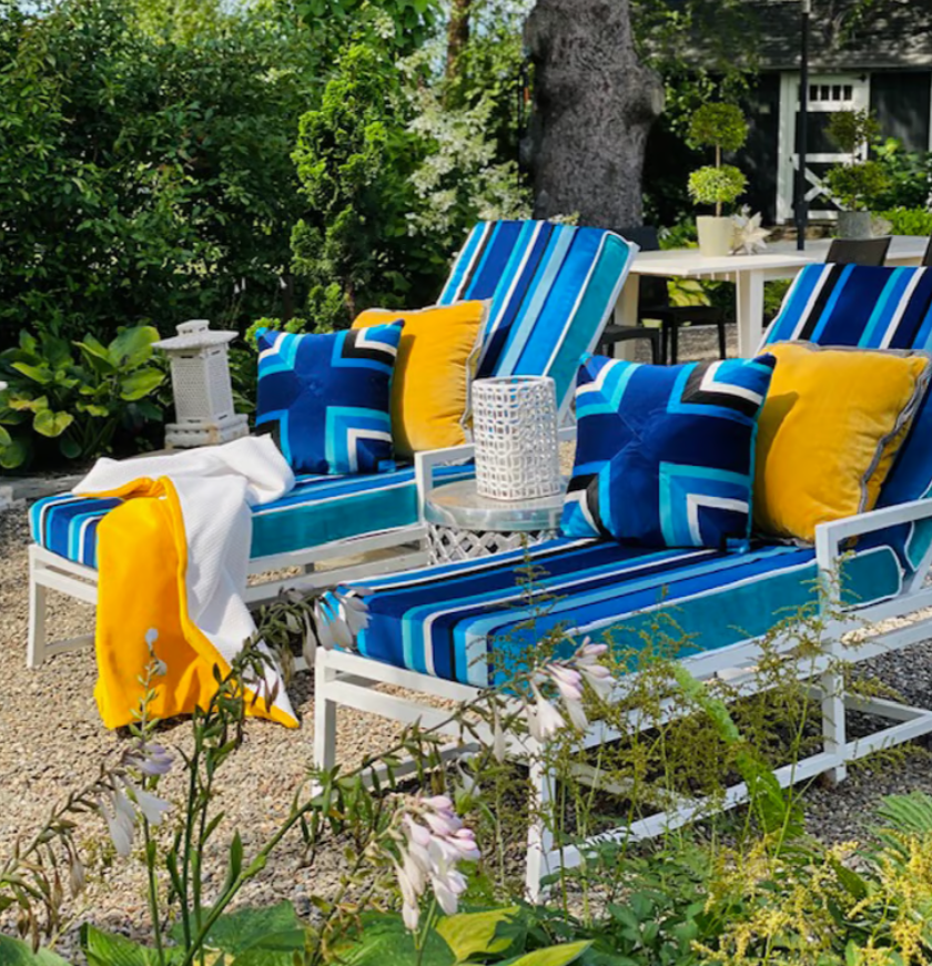 south beach strip fabric in sapphire covering two outdoor white sun loungers