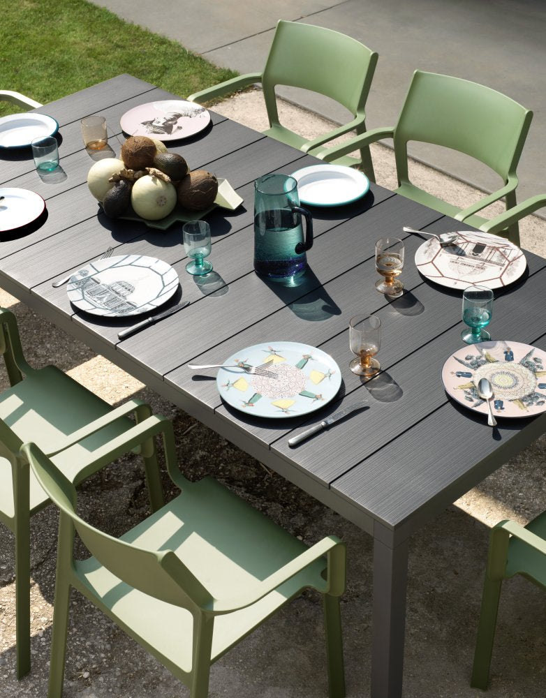 Nardi Trill Outdoor Armchair in olive green outdoor setting with table and setting