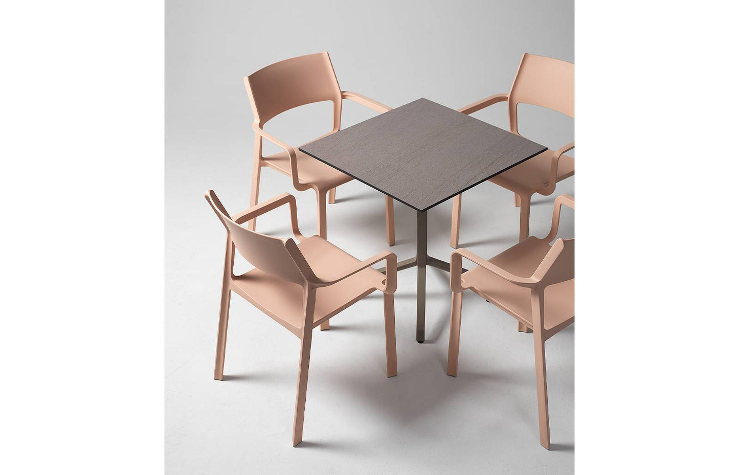 Nardi Trill Outdoor Armchair in Pink around a table
