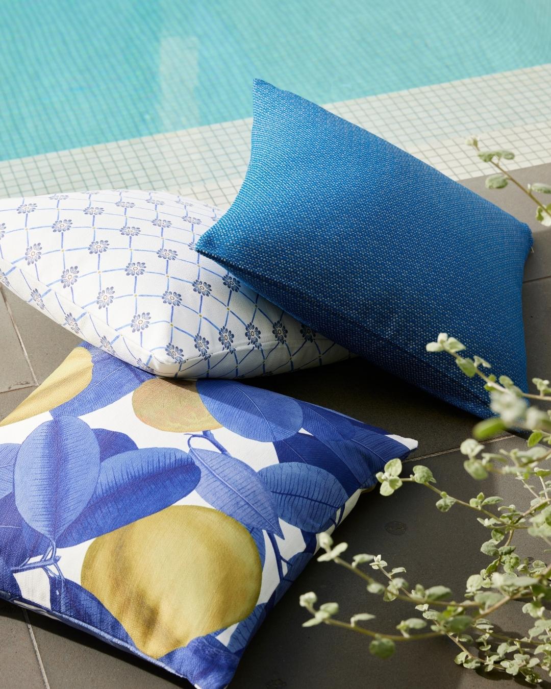 Elba cushion in white and blue geometric pattern with cobalt blue cushion and blue and white cushion wit h yellow lemons