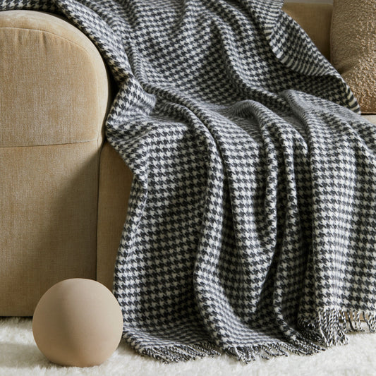 Huxter wool throw from Weave Home, houndstooth check in black and cream