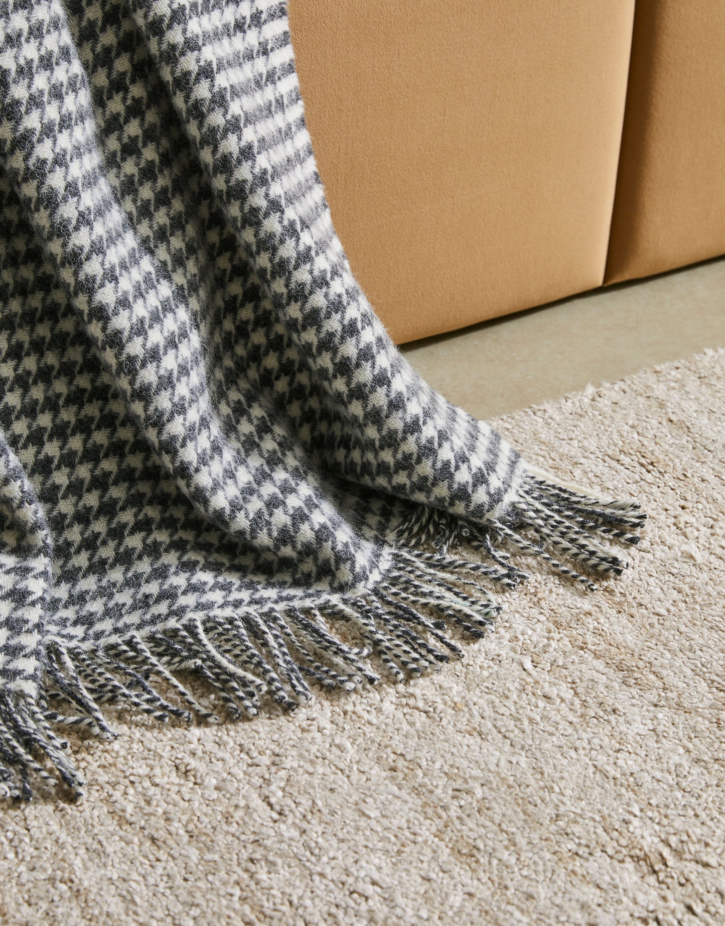 Huxter wool throw from Weave Home, houndstooth check in black and cream