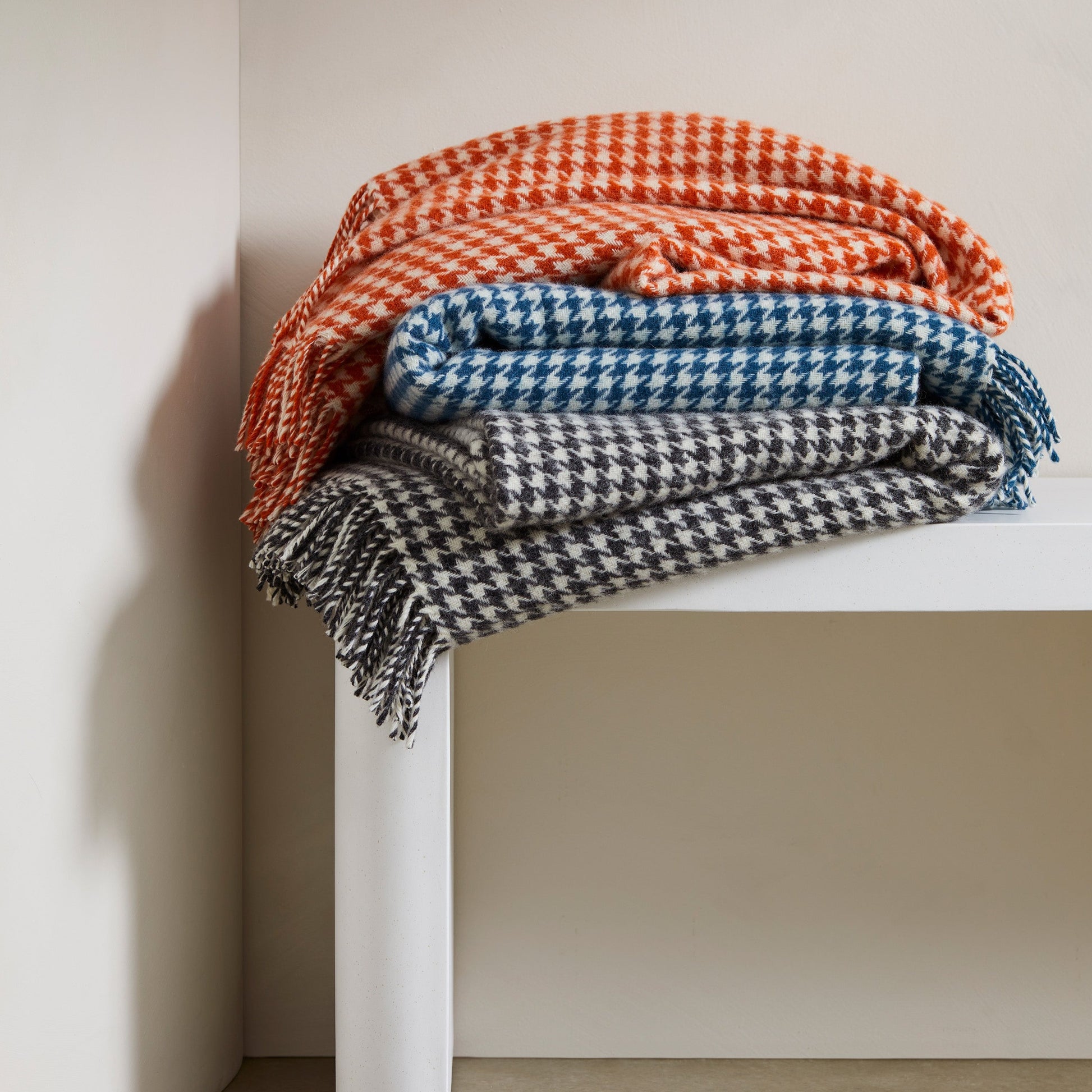 Huxter wool throw in pumpkin from Weave Home stack