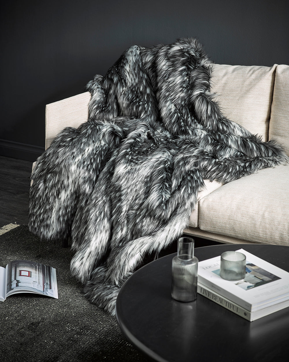 Alaskan wolf imitation fur throw over a cream sofa