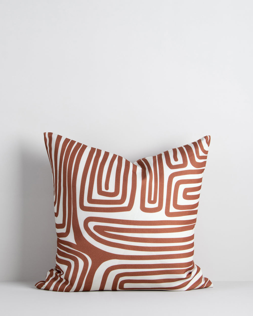 Ano outdoor cushion, rust abstract lines