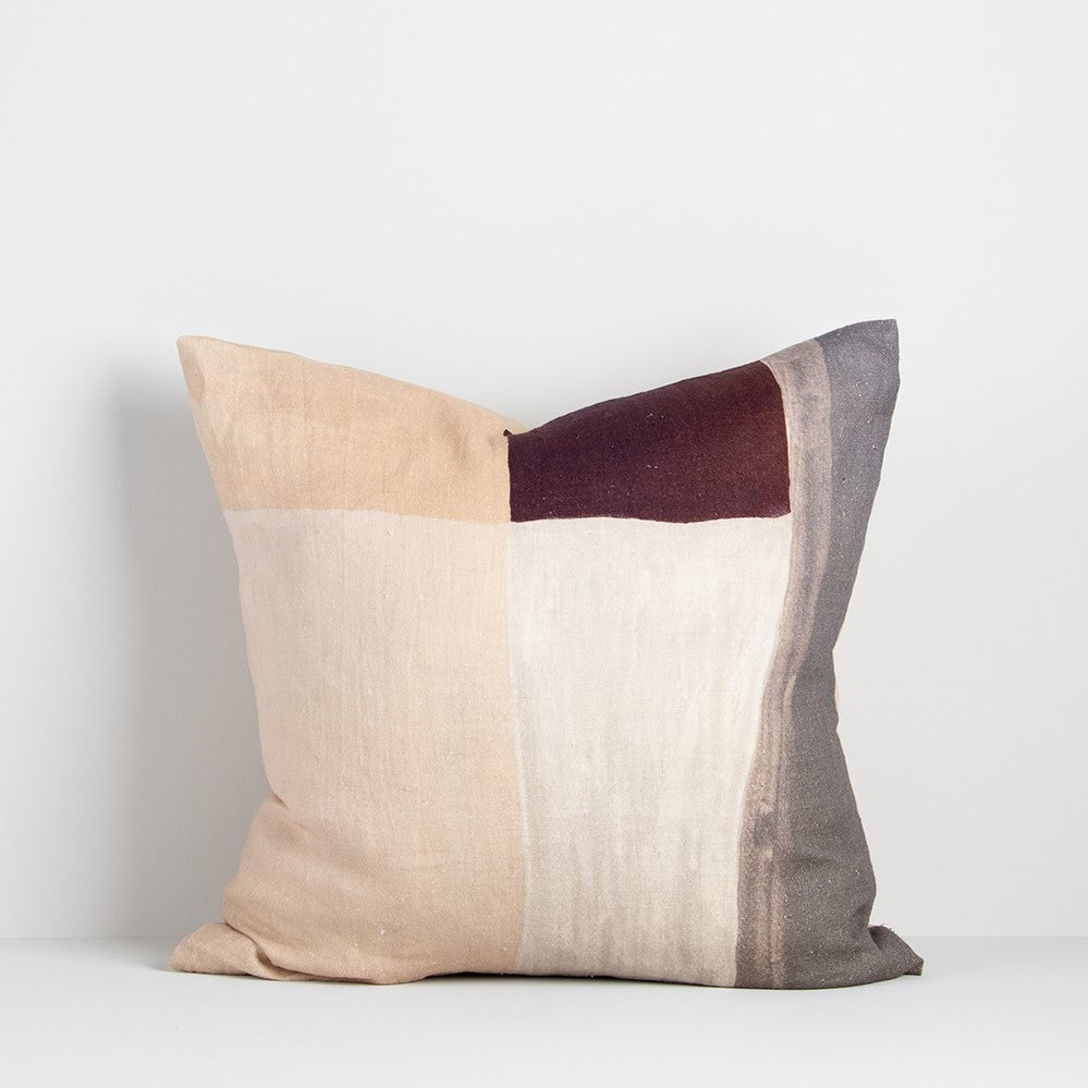 benny cushion from baya with grey, port red, beige and cream brushstrock pattern