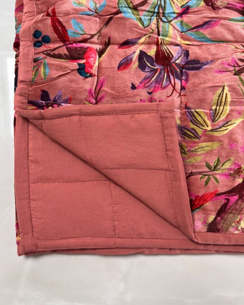 Bird of paradise quilted velvet throw in dusty pink