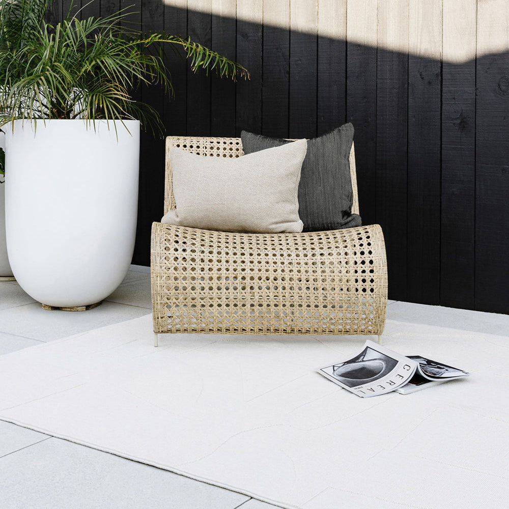 copacabana outdoor bone rug by a pool