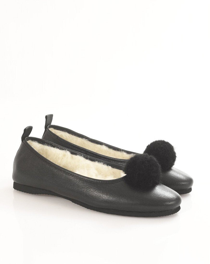 Italian Leather Ballet Slippers in black with a pom pom, wool lining and rubber sole. Luxury slippers from My Sanctuary