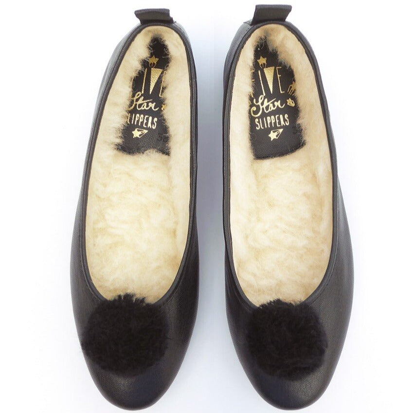 Italian Leather Ballet Slippers in black with a pom pom, wool lining and rubber sole. Luxury slippers from My Sanctuary