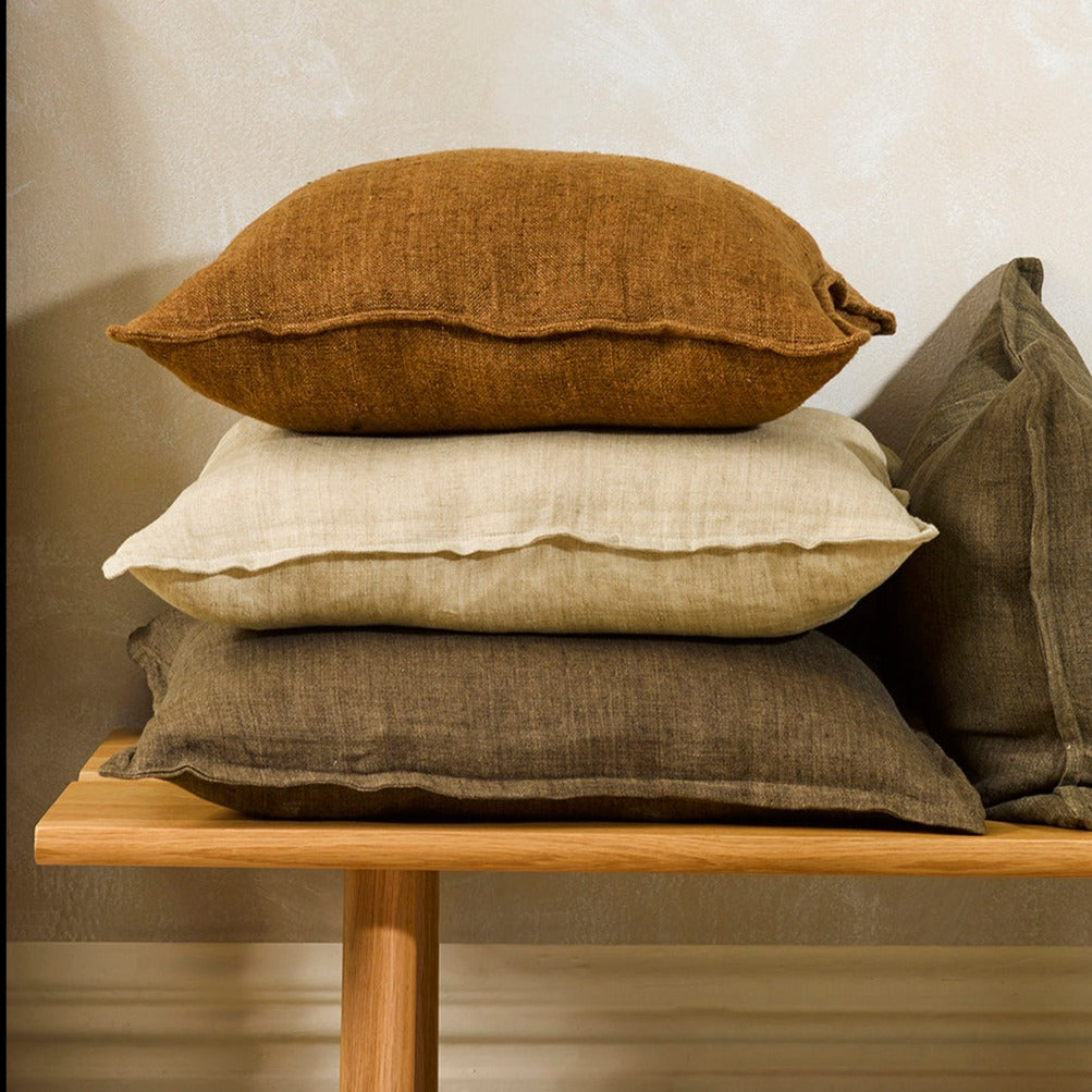 Flaxmill linen cushions, stack and lifestyle shot