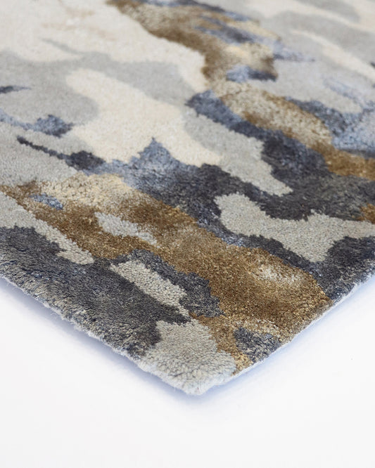 Fleur Multi Rug from Mulberi, abstract pattern of gold, greys, beignes and creams close up