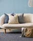 Keaton Linen cushion in navy on small sofa with beach coloured cushions