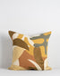 Baya Collection of cushions with matisse and jungle inspired patters in rust, olive, yellow and amber also plain nutmeg linen cushion and wool carpet in pecan