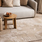 Paolo rug - pale cream with a wooden side table and cream sofa and cushions