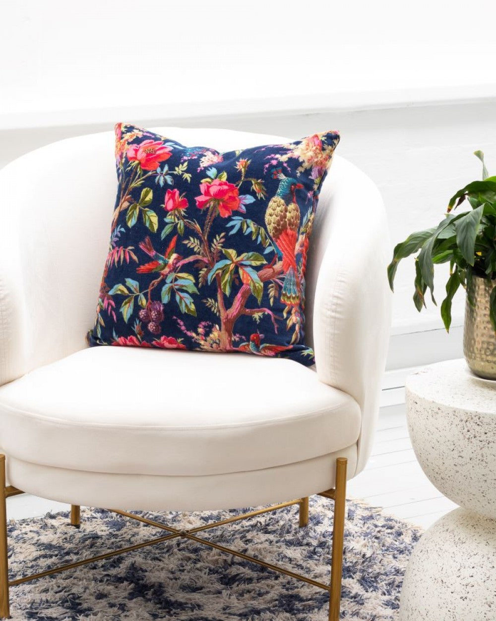 Paradise navy velvet cushion with bird of paradise pattern