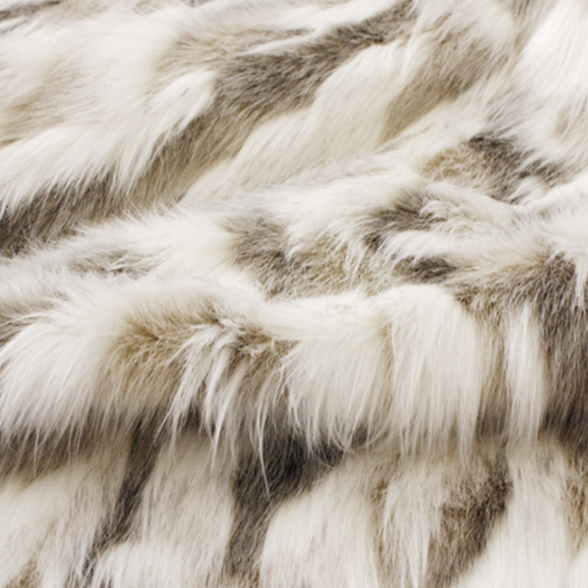 Luxury faux fur throw in cream and brown from Heirloom.  These are the best fake fur throws, super soft for NZ interior design. Snowhare.