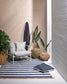 Summit outdoor rug with chair, rattan vases and cushion