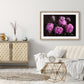 pink peonies wall art in a white lounge with white sofa, cushions and throws and a grey side cabinet with grey vases on top and grey wall. Gold wire coffee table