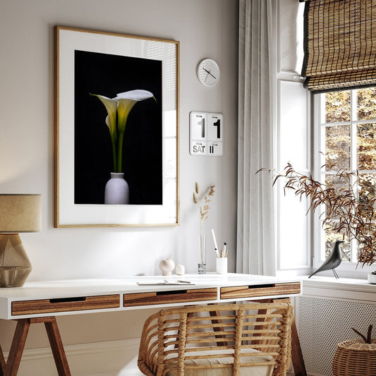 white arum lily floral art print in a lifestyle shot over a desk
